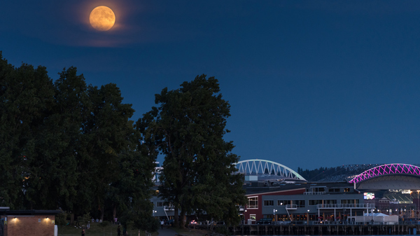 A Full Moon from Myrtle Edwards Park early in the evening on a warm summer night.